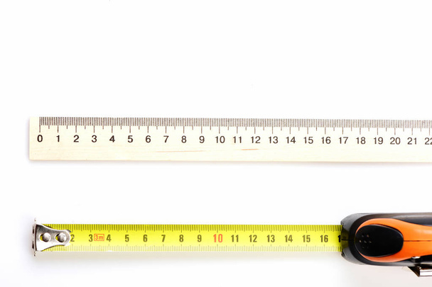 Tape measure near wooden school ruler - 写真・画像