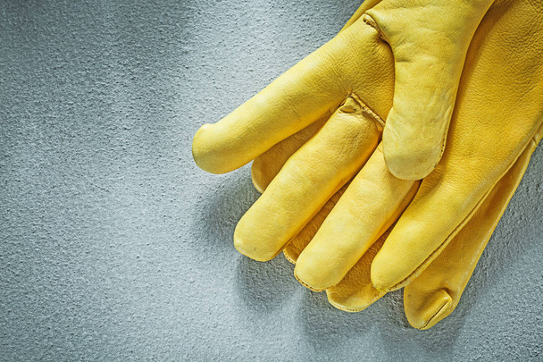 Leather protective gloves on concrete background construction co - Foto, Imagen