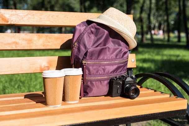 Backpack with camera and paper cups - Photo, Image