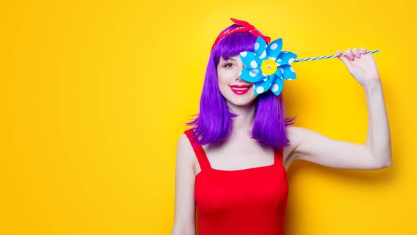 young woman with pinwheel toy - Foto, Imagem