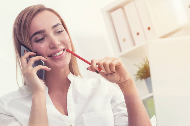 Smiling businesswoman on the phone - Fotó, kép