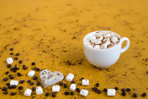 Coffee with marsh-mallows on yellow background - Photo, Image