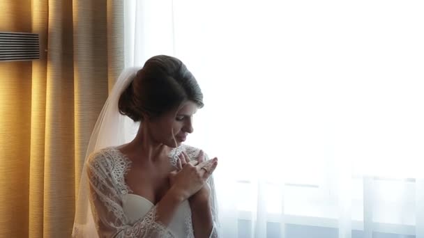 charming bride in white dress wearing ring - Footage, Video