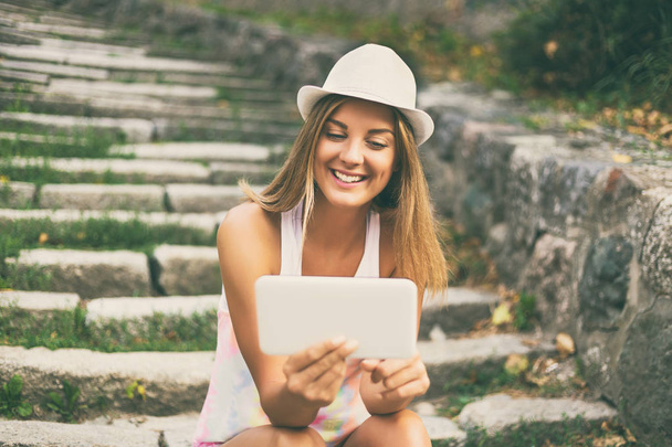 Young woman using digital tablet  - Zdjęcie, obraz