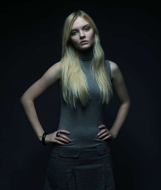 Portrait of beautiful young blonde girl in black dress. - Fotoğraf, Görsel