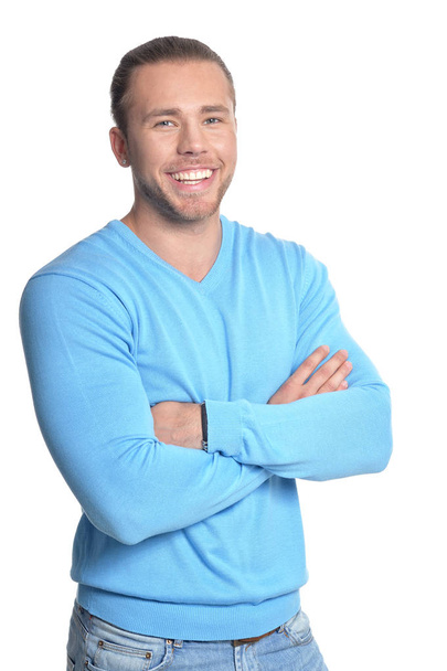 schöner junger Mann im blauen Pullover   - Foto, Bild