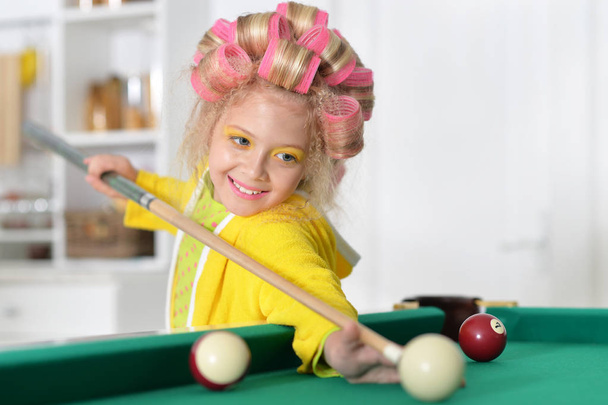 cute girl  playing billiard - Foto, immagini