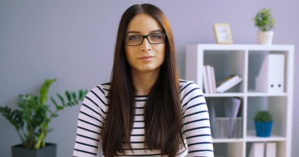 attractive young woman in glasses - Filmati, video