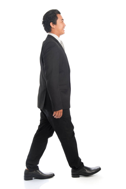 Side view Asian business man walking - Valokuva, kuva