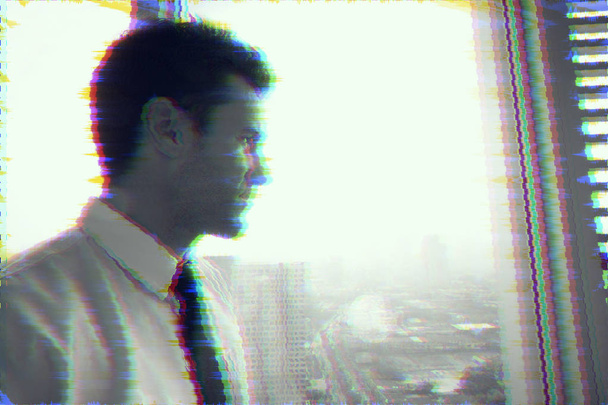 Glitch effect of businessman looking at the city out side the window, thinking. Stock Photo - Fotoğraf, Görsel