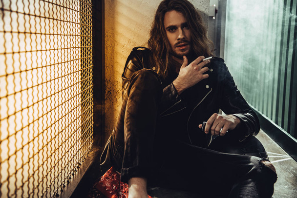 Stylish long haired man with cigarette - Fotoğraf, Görsel
