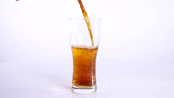 dark Beer is pouring into glass on white background - Video