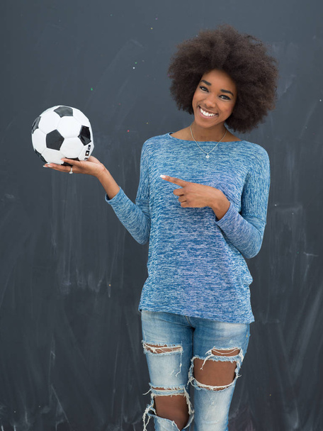 black woman holding a soccer bal - Foto, Bild