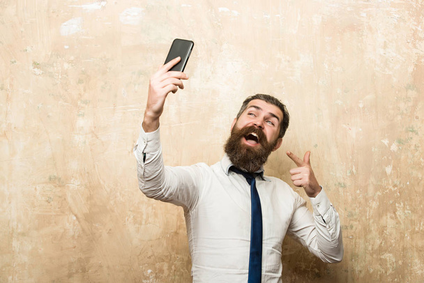 businessman or bearded man with long beard speaking on phone - Fotó, kép