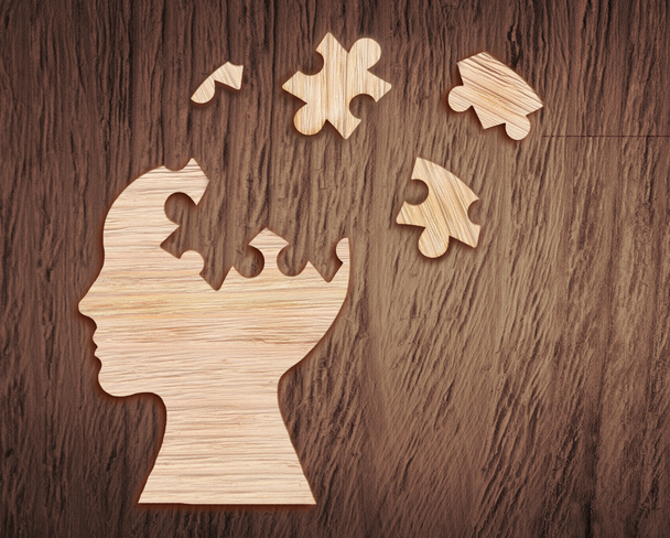 Human head silhouette with a jigsaw piece cut out - Photo, Image