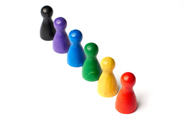 Game figures stand together. Colorful game figures. Concept for homosexuality, gay marriage, diversity and tolerance. Top down view. - Photo, Image