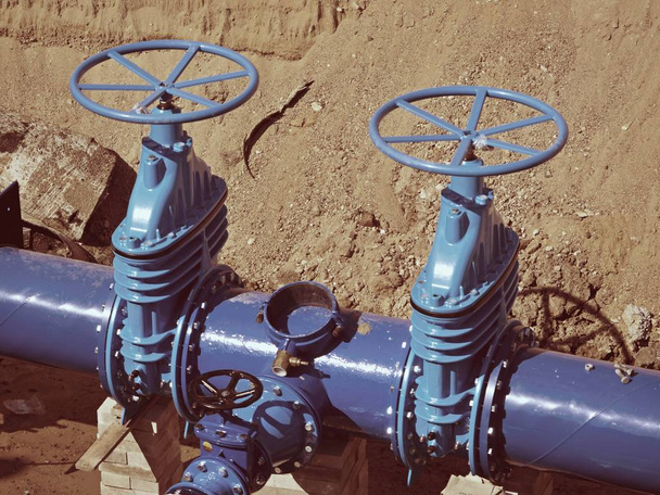 Gate valves underground, water pipeline valve on a blue pipeline after reconstruction.  - Photo, Image