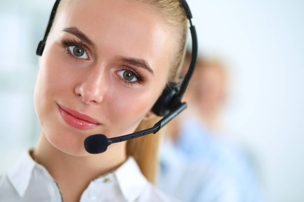 Attractive positive young businesspeople and colleagues in a call center office - Fotoğraf, Görsel