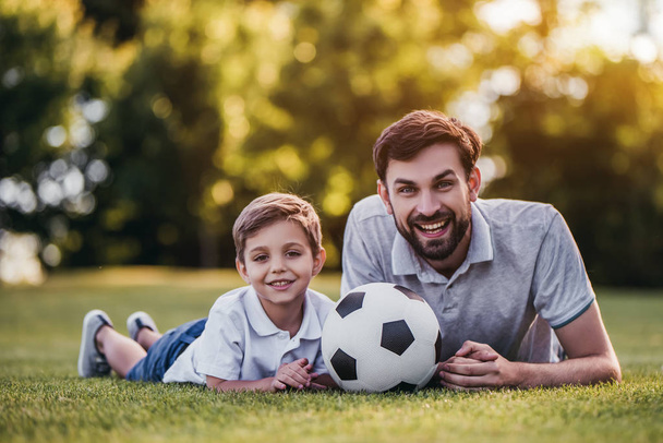 Dad with son playing football - Фото, изображение