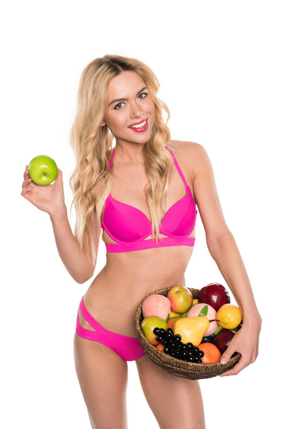 mujer en traje de baño con frutas
  - Foto, Imagen