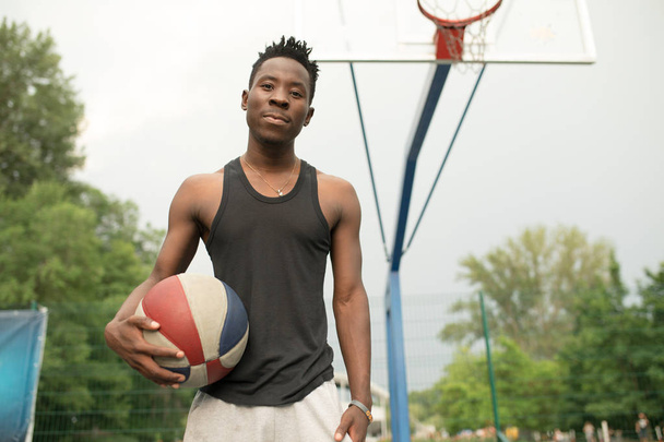 Portrait of african american man on basketball court keep ball - Photo, Image