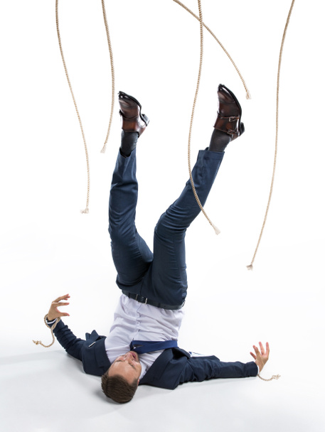 businessman and manipulating ropes - Photo, Image