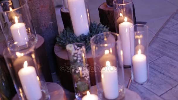 Lighted candles on the floor like decor for the wedding day. Close up shot. - Materiał filmowy, wideo