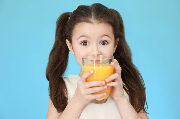 Cute little girl drinking juice  - Fotó, kép