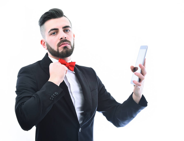 Business consultant with beard and red bow tie holds tablet - Fotografie, Obrázek