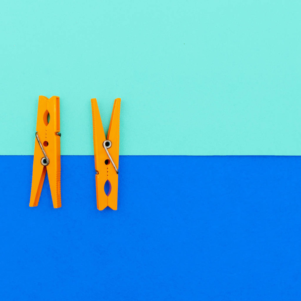 Orange clothespins.minimal art style - Foto, Imagen