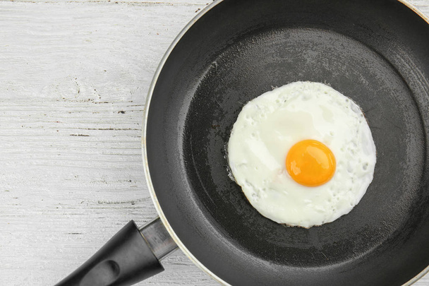 Frying pan with tasty egg  - 写真・画像