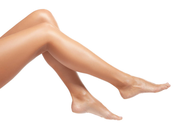 Female legs on white background  - Foto, imagen