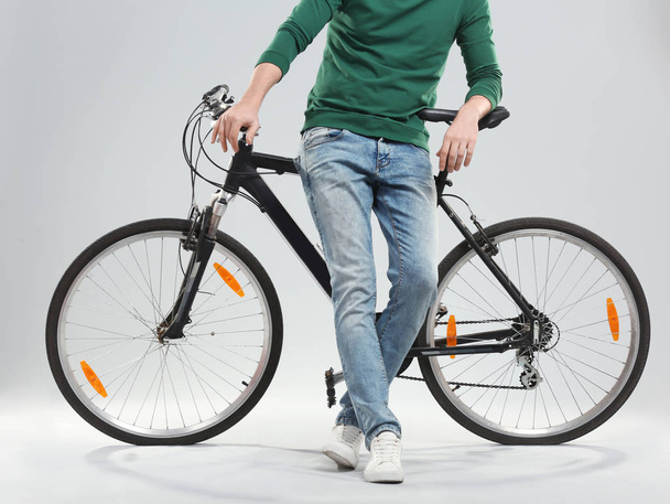 Handsome young man with bicycle - Fotoğraf, Görsel