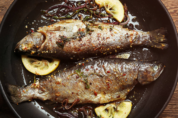 Frying pan with tasty trout fish,   - Photo, Image