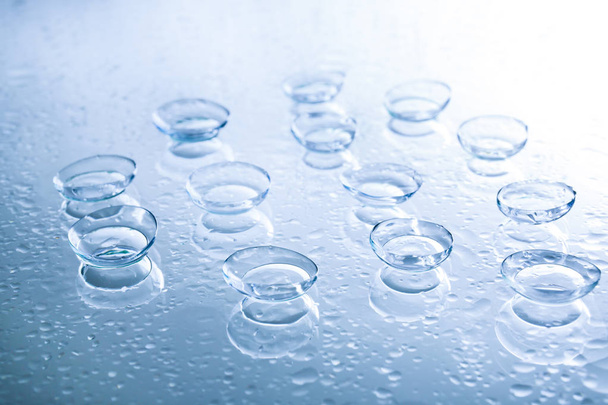 Contact lenses and drops of water - Φωτογραφία, εικόνα