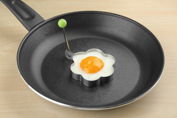 Frying pan with tasty egg  - Foto, afbeelding