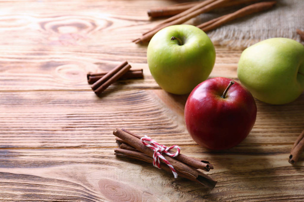 Apples with cinnamon sticks   - Foto, afbeelding