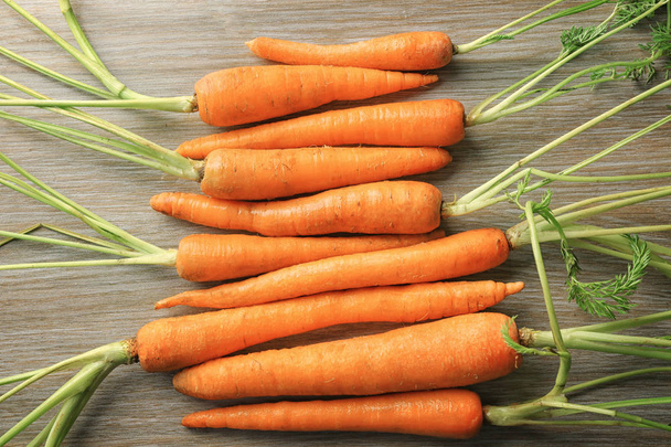 Fresh and sweet carrot on  table - Valokuva, kuva
