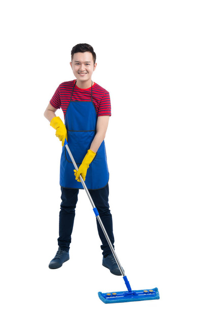 Handsome man doing housework. - Фото, изображение