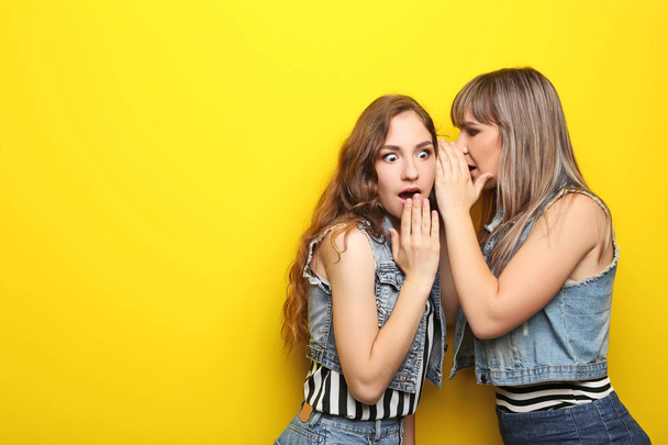 Young women whispering secret  - Фото, зображення