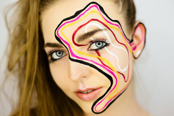 Portrait of beautiful girl with creative make up - Foto, afbeelding