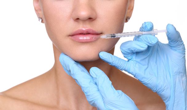 Beautiful woman gets an injection in her lips - Φωτογραφία, εικόνα