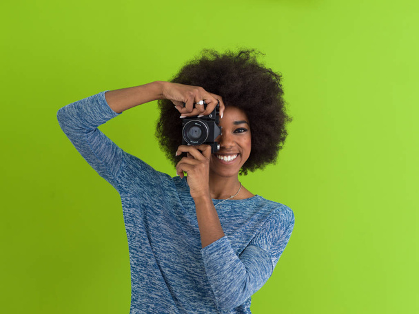 black girl taking photo on a retro camera - Foto, Bild