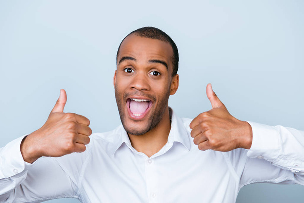 Cheerful successful african employer is showing thumbsup on a pu - Fotoğraf, Görsel