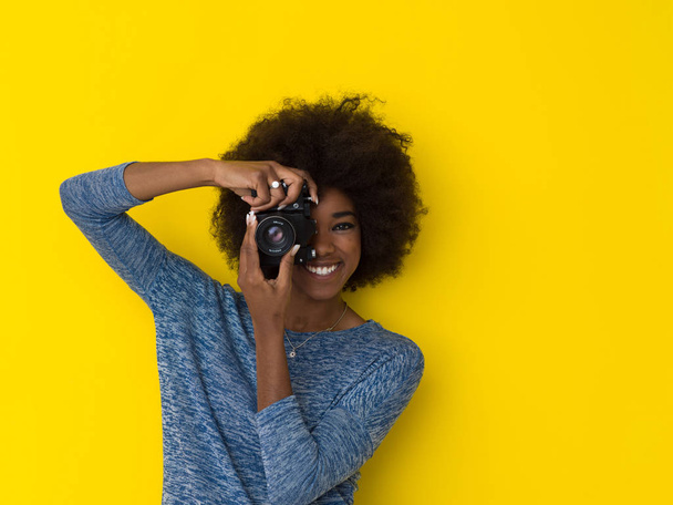 young african american girl taking photo on a retro camera - Photo, image