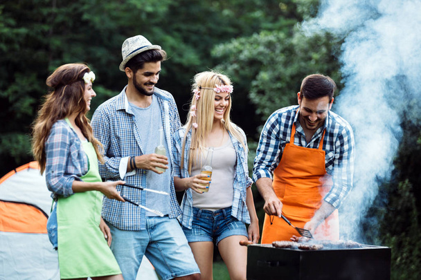 Friends spending time in nature and having barbecue - Foto, Imagem