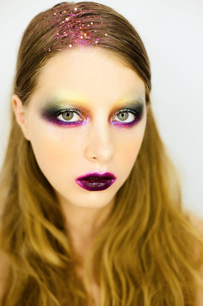 Portrait of beautiful girl with creative colorful make up - Foto, Imagem