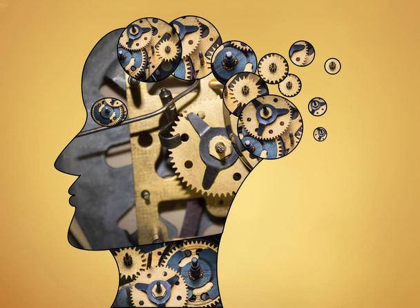 The male head is filled with gears on gold background. - Photo, Image