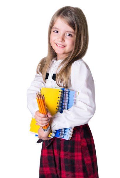 School girl child with school supplies isolated on white. - Valokuva, kuva