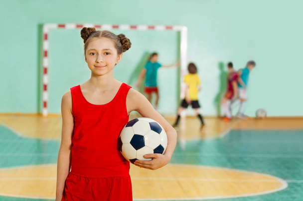 happy girl standing with ball - Фото, изображение